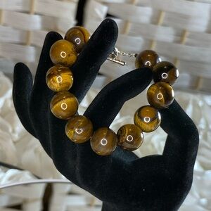 Yellow Tiger's Eye 13-15mm Beaded
Bracelet in Stainless Steel 7.50” 280.00
ctw